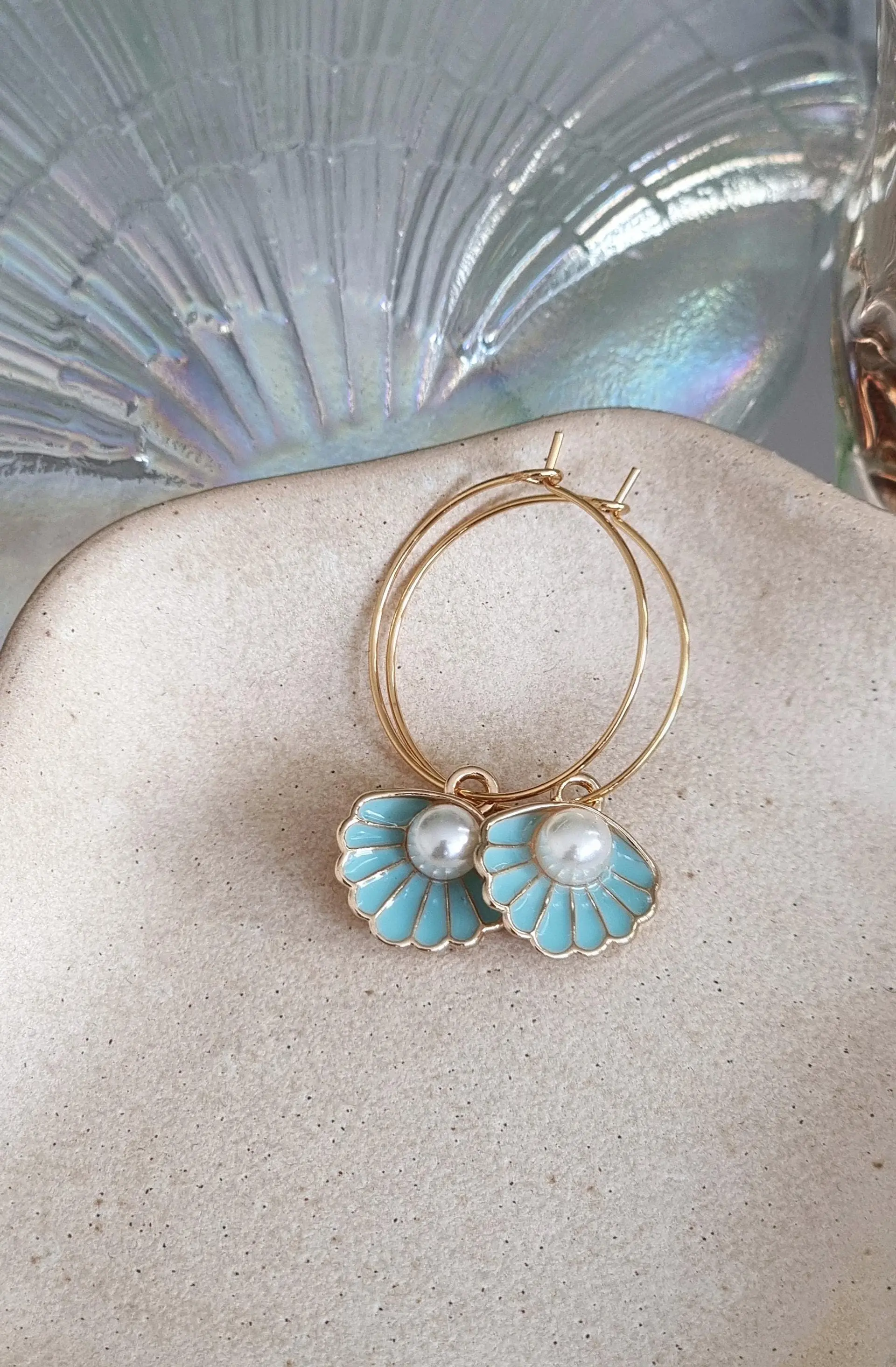 Fine stainless steel hoop earrings with shell pendant, blue
