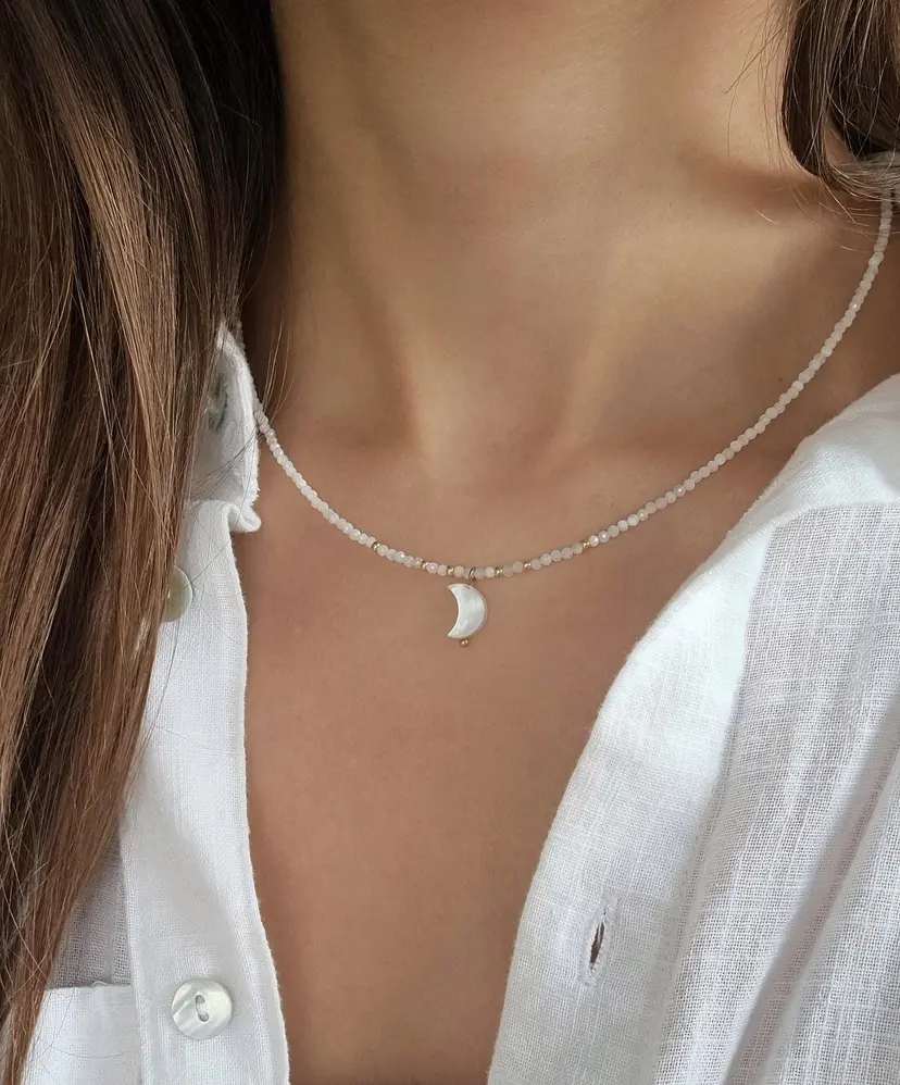 Delicate moonstone semi-precious stone beaded necklace with a mother-of-pearl crescent moon and stainless steel clasp