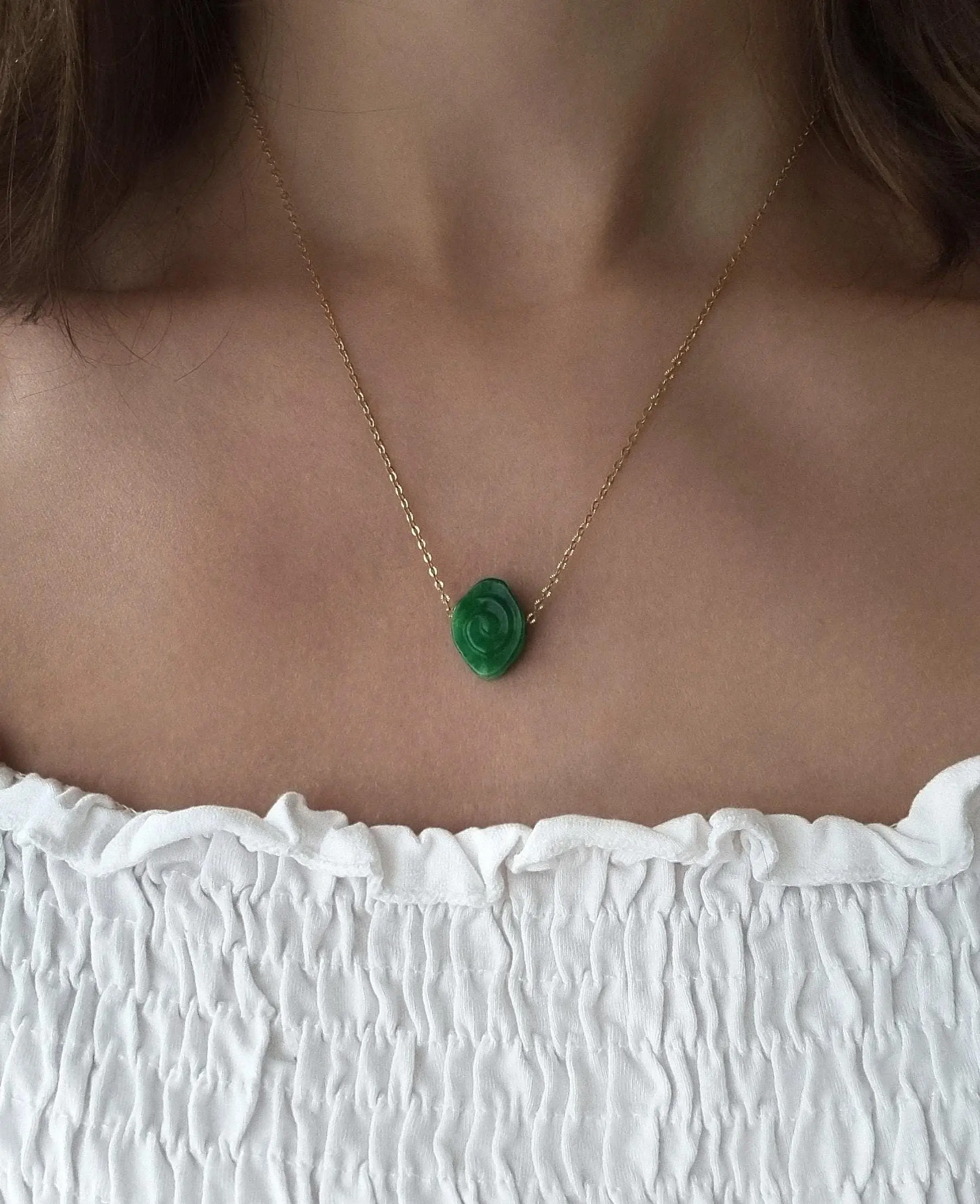 Stainless steel necklace with semi-precious green jade swirl/spiral, waterproof.