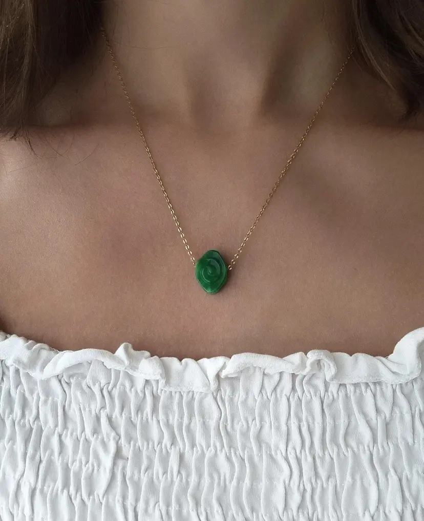 Stainless steel necklace with semi-precious green jade swirl/spiral, waterproof.