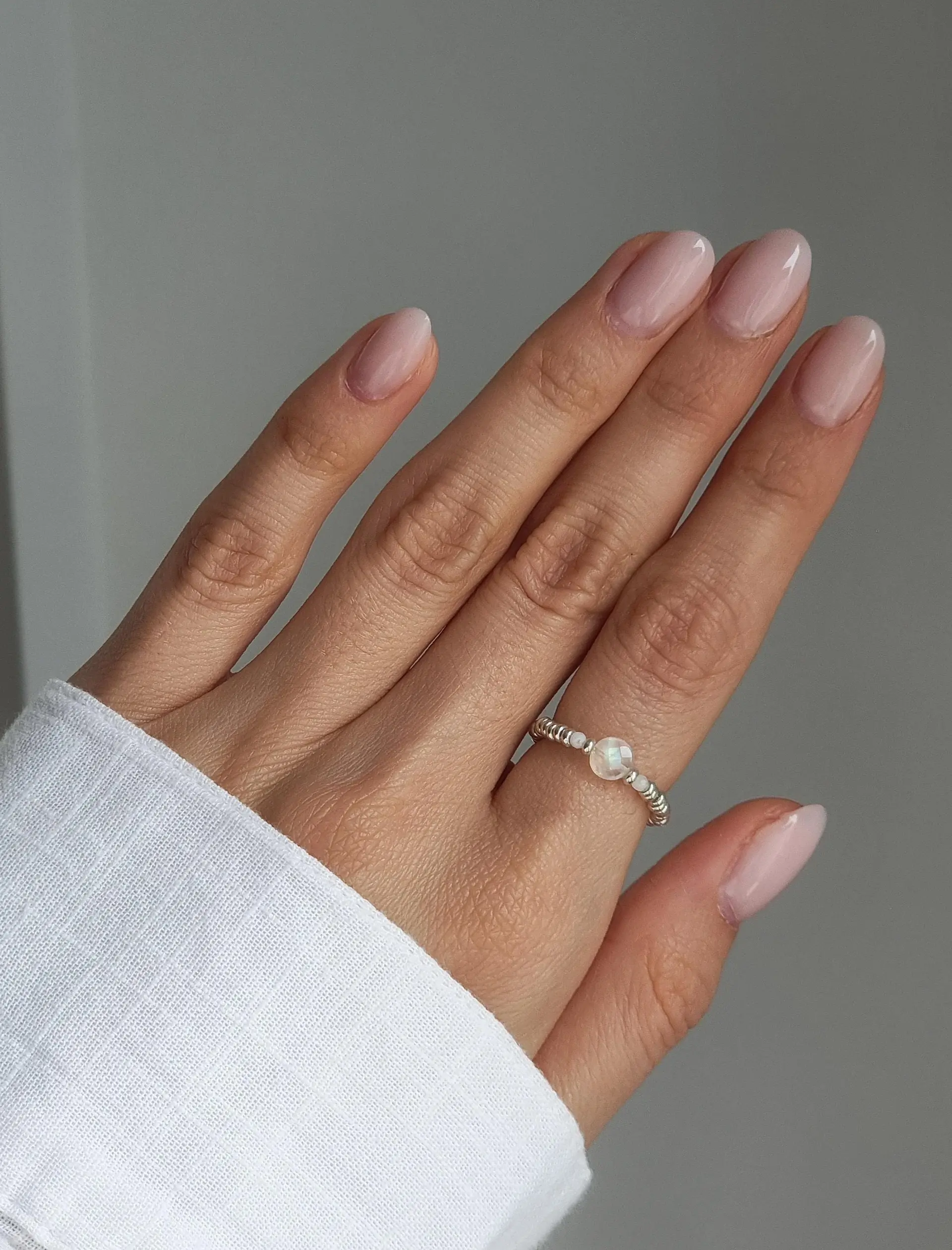 Delicate elastic beaded ring with rainbow moonstone beads, silver-colored Miyuki